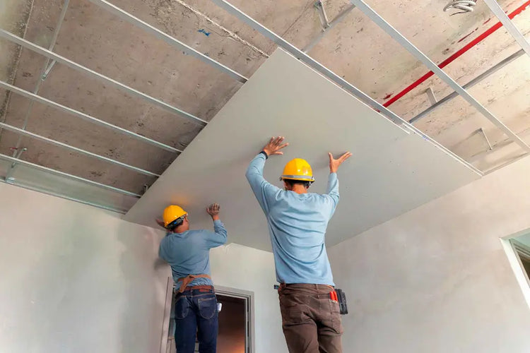 man installing suspended ceiling