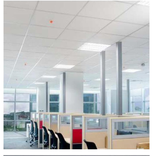 Modern office interior with glass partitions and ceiling lights.